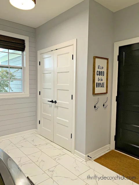 Laundry/mud room with closet for vacuums