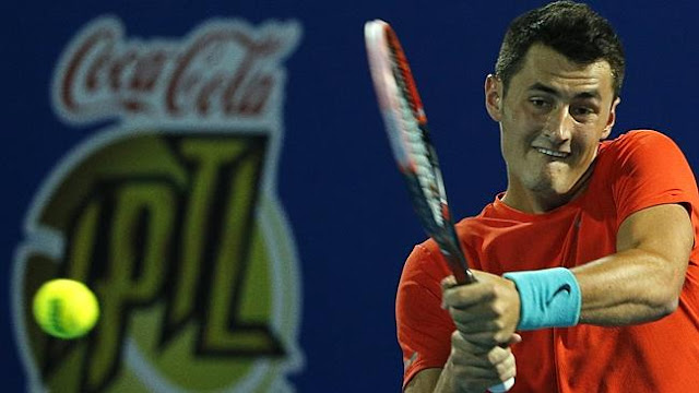 Australia's Bernard Tomic has been in Dubai this week playing for the Micromax Indian Aces - here he returns the ball to Croatia's Ivo Karlovic of Philippine Mavericks during the men's singles match in their International Premier Tennis League (IPTL). AFP PHOTO / KARIM SAHIB