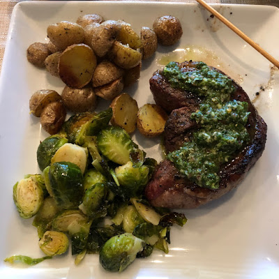 Rare grilled picanha with chimichurri, oven roasted baby potatoes and Brussels sprouts