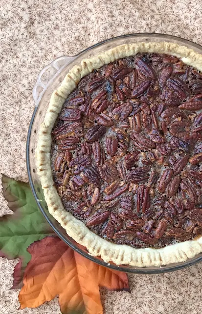 Maple pecan pie with fall leaves.