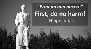 Statue of Hippocrates with the words, "First do no harm"