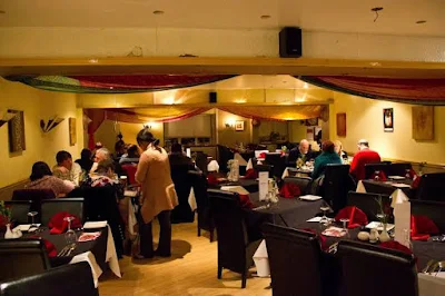 An Indian restaurant is hoping to win back customers afraid of eating out during the pandemic with a special “COVID Curry” and “Mask Naans”.