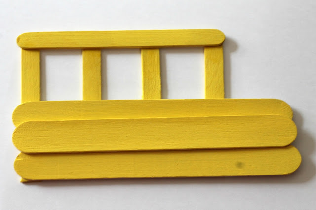 This craft stick school bus frame is easy for kids to make and a fun way to celebrate back to school.