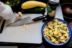 image of kitchen area where roasted zucchini and summer squash is prepared, plus a plate of the finished dish