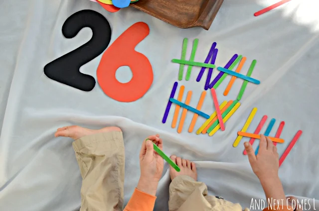 Using colored craft sticks to count tally marks up to 26