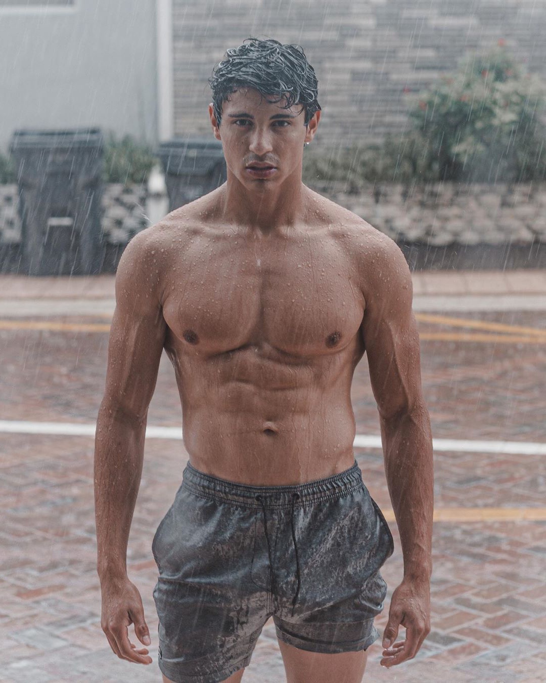 cute-fit-shirtless-wet-guy-raining-outdoor-mysterious-young-hunk