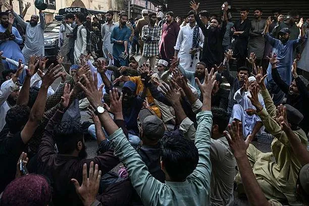 Members of religious groups chant slogans as they gather outside an Ahmadiyya place of worship in Karachi on April 18, 2025. Photo by Rizwan Tabassum/AFP