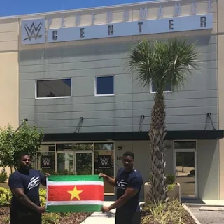 " The dongo brothers holding the Surinamese vlag in front of the W.W.E. performance center"