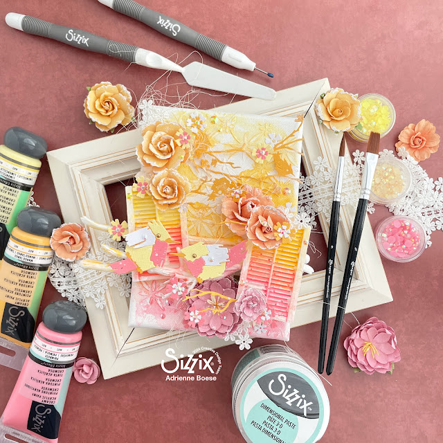 Mixed media canvas created with acrylic paint made to mimic watercolors, Sizzix Painted Bird and Woodland Cardfront Dies, and Prima Marketing flowers.