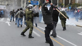 Police and protesters clash in Athens