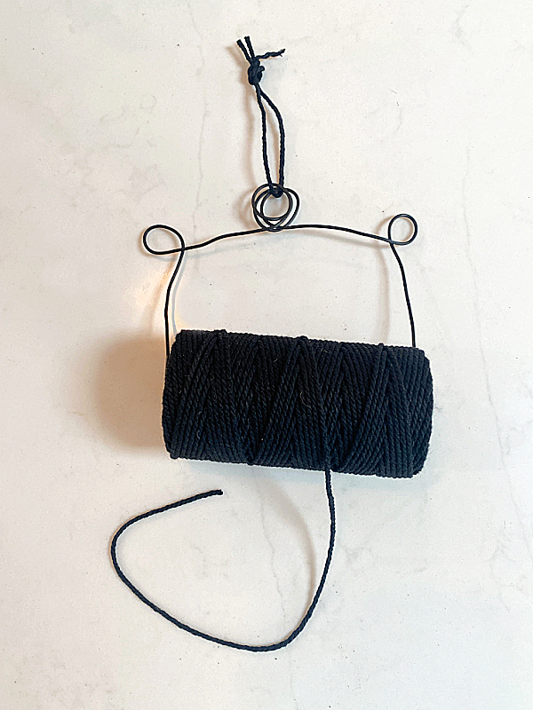 string holder with black twine