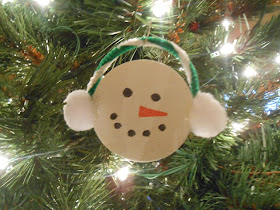 Snowman ornament from a plastic lid