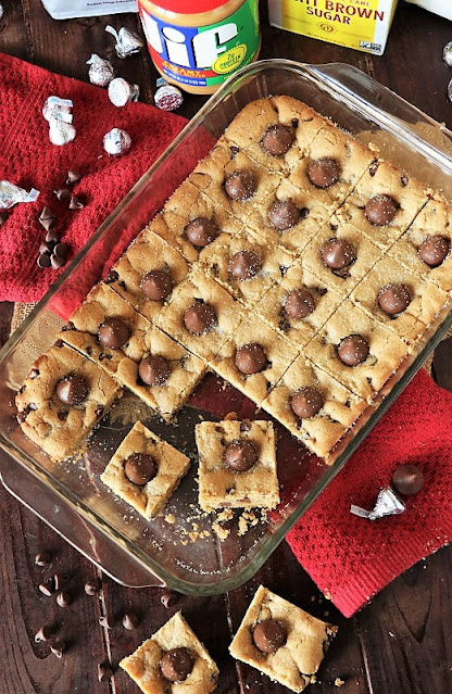 Top View of Cut Peanut Butter Blossom Bars in Baking Dish Image