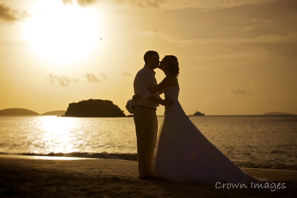 ... as the sunsets behind them at their st john destination wedding