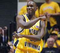 Frank hugs his imaginary friend 'Sammy' after hitting another three.