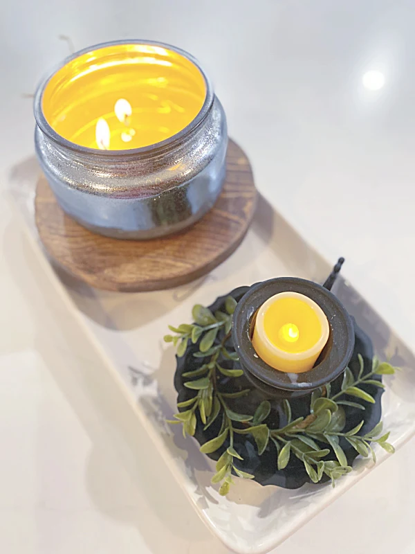 candles with a footed riser