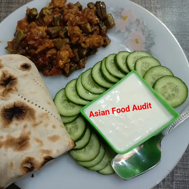 A plate of Chicken Bhindi, a delicious Sehri dish for Ramadan, featuring tender chicken pieces and sliced okra cooked with aromatic spices, garnished with fresh coriander leaves.