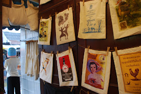 t-shirts and bags from Aui - One of Us vintage t-shirts in Bangkok's Chatuchak Market
