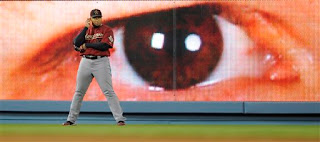 Giants eyes on the wall at Dodger Stadium stare at Carlos Lee