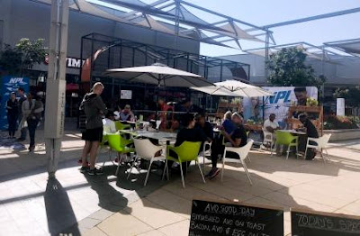 Sprout Café customers seated outside under sun and ample shade