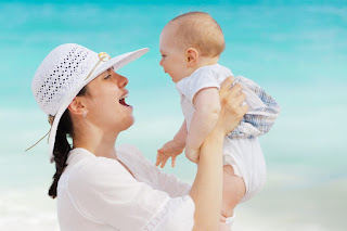 baby enjoying the beach