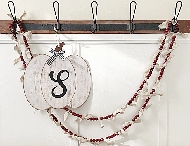 red beads and rag bow garland on hooks