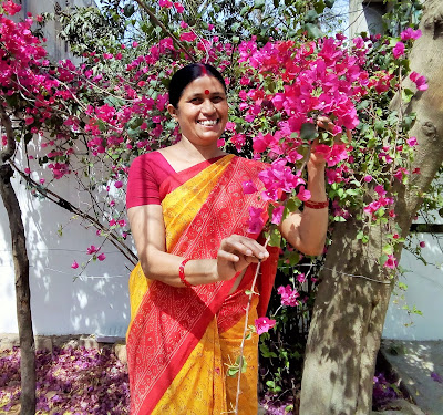 Indian Woman happy smiling in flowers nature