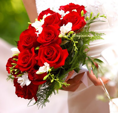  a wedding bouquet with a combination of red and white is simply lovely