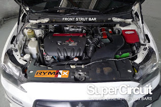 Mitsubishi Lancer GT 2007-2017 engine bay with the SUPERCIRCUIT Front Strut Bar installed.