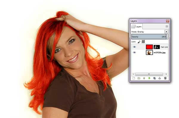 Using your mouse, apply brush strokes to the layer mask to reveal the red hair.