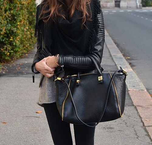 black leather jacket with gold zippers 