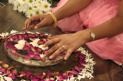 Making a pookalam - a flower rangoli