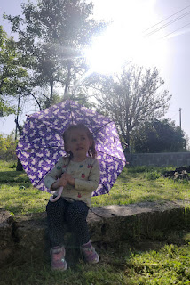 Rosie sheltering from "pretend rain"