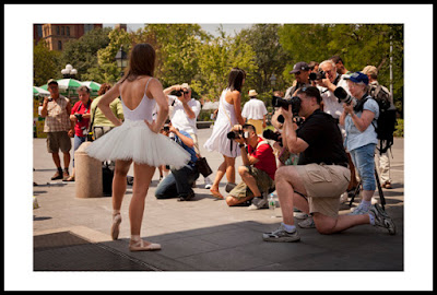 a photograph of a ballerina and several photographers in a park in new york