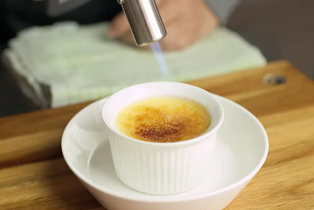 torch the sugar to caramelise.