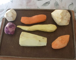 And now for those who are truly fascinated, just peeled -- Upper left = Boniato; Upper center = Red Garnet Yam; Upper right = Tropical Yam; Center left = Purple Potato; Center middle = Japanese Yam; Bottom middle = Ghana Yam; Bottom right = American sweet potato; 