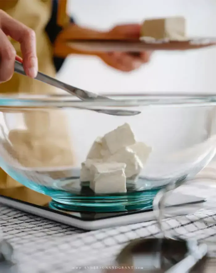 Putting butter into a bowl