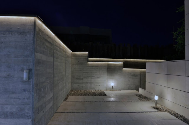 Driveway of The Memory House by A-Cero Architects at night 