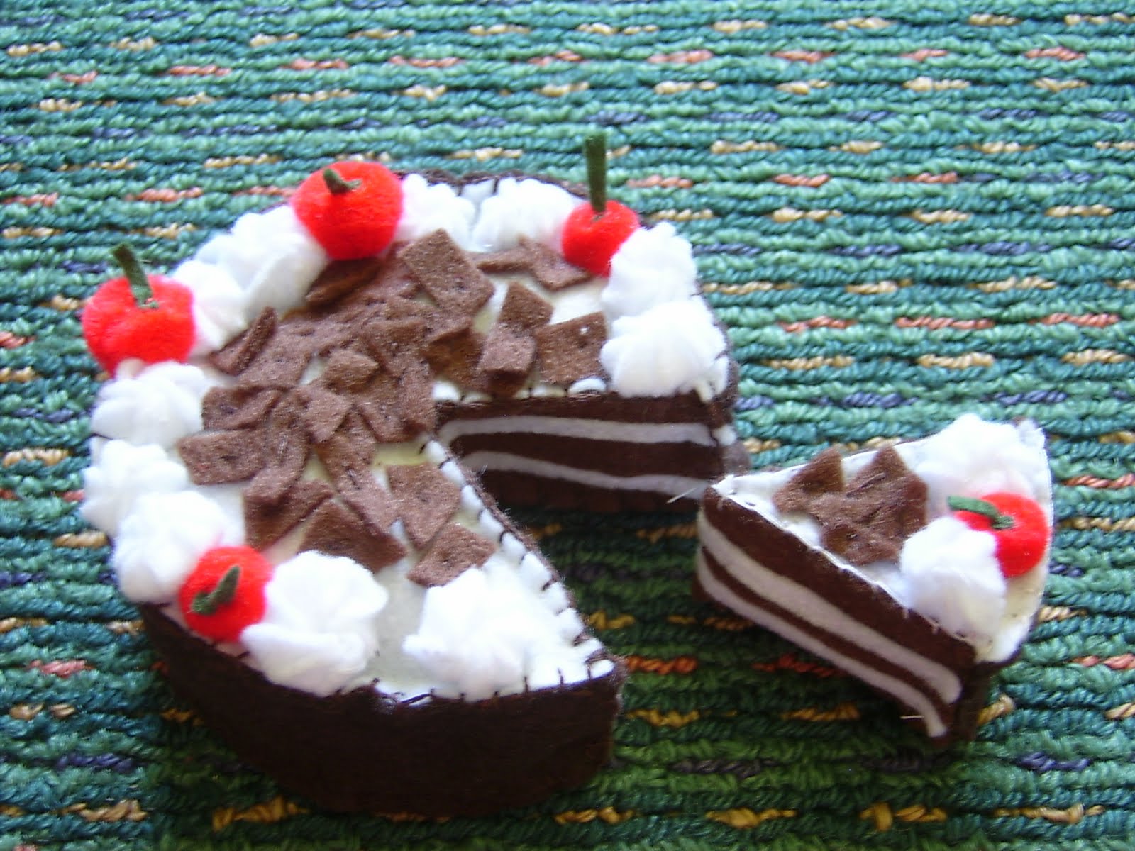 chocolate cake with strawberries and whipped cream these 2 felt cakes I made a while ago.