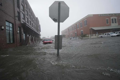 Flood waters move on the street, Wednesday, Sept. 16, 2020, in downtown Pensacola, Florida.