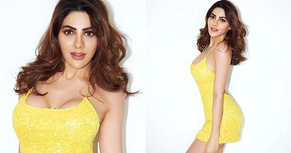 Nikki Tamboli cleavage sexy body yellow dress