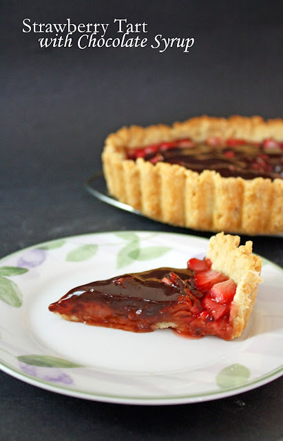 strawberry tart with chocolate syrup