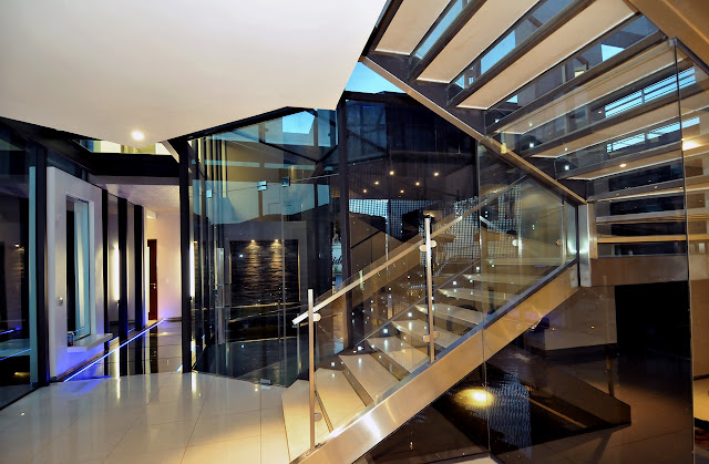 Glass staircase to the upper floor 
