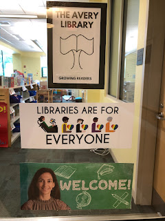 Door of the library displaying welcome sign