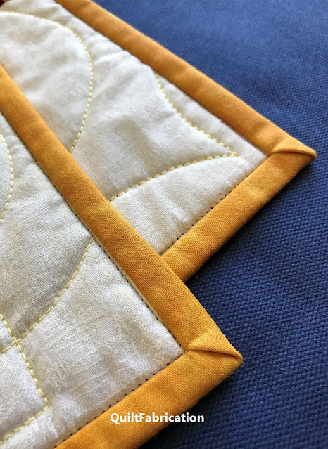 flat beautiful quilt corners using the reduce bulky corners tutorial from QuiltFabrication