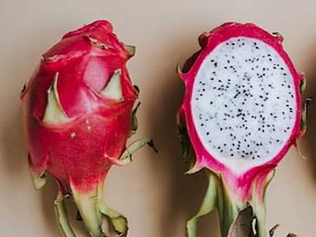 Dragon Fruit, the cut fruit shows the tiny seeds.