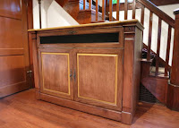 Adonzo Unfinished TV Lift Cabinet stained in American Walnut. 