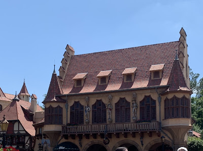 A German building at Epcot with a Green Beer sign.