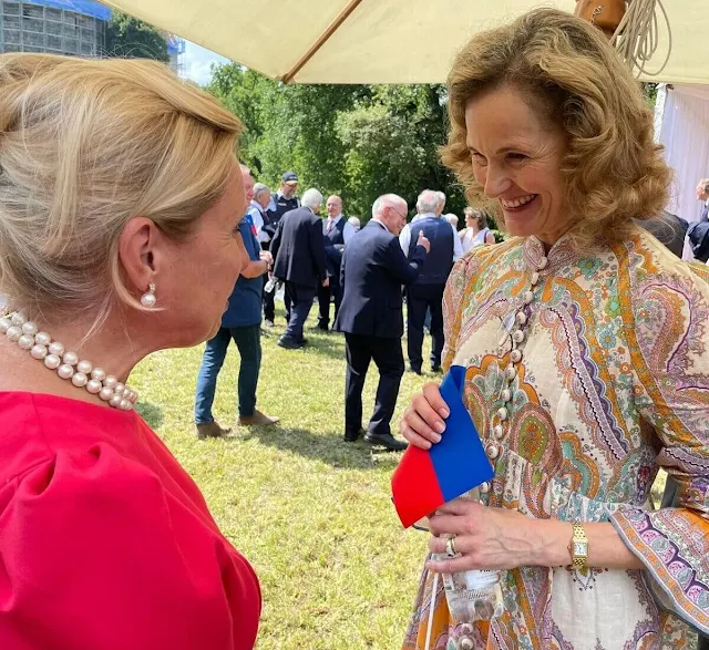 Princess Sophie wore a Lola paisley midi dress by Zimmermann. Princess Marie-Caroline wore a green top and skirt by Kenzo