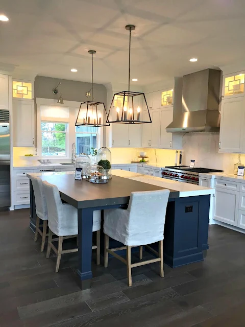 dark blue island white cabinets